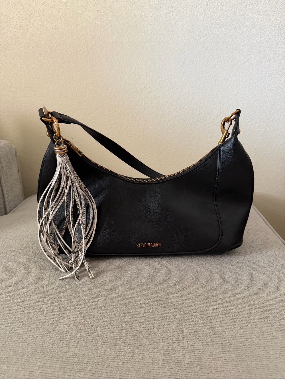 Steve Madden Black Leather Shoulder Bag with Silver-Tone Tassel Accent